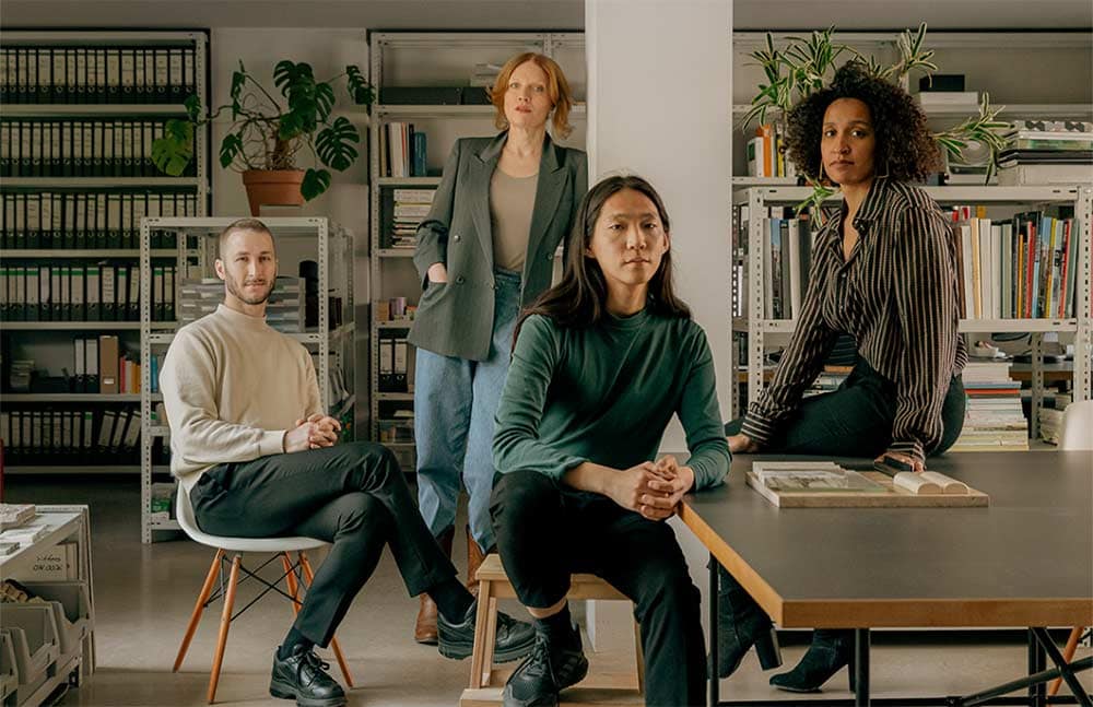 Modern office workspace with diverse professionals.
