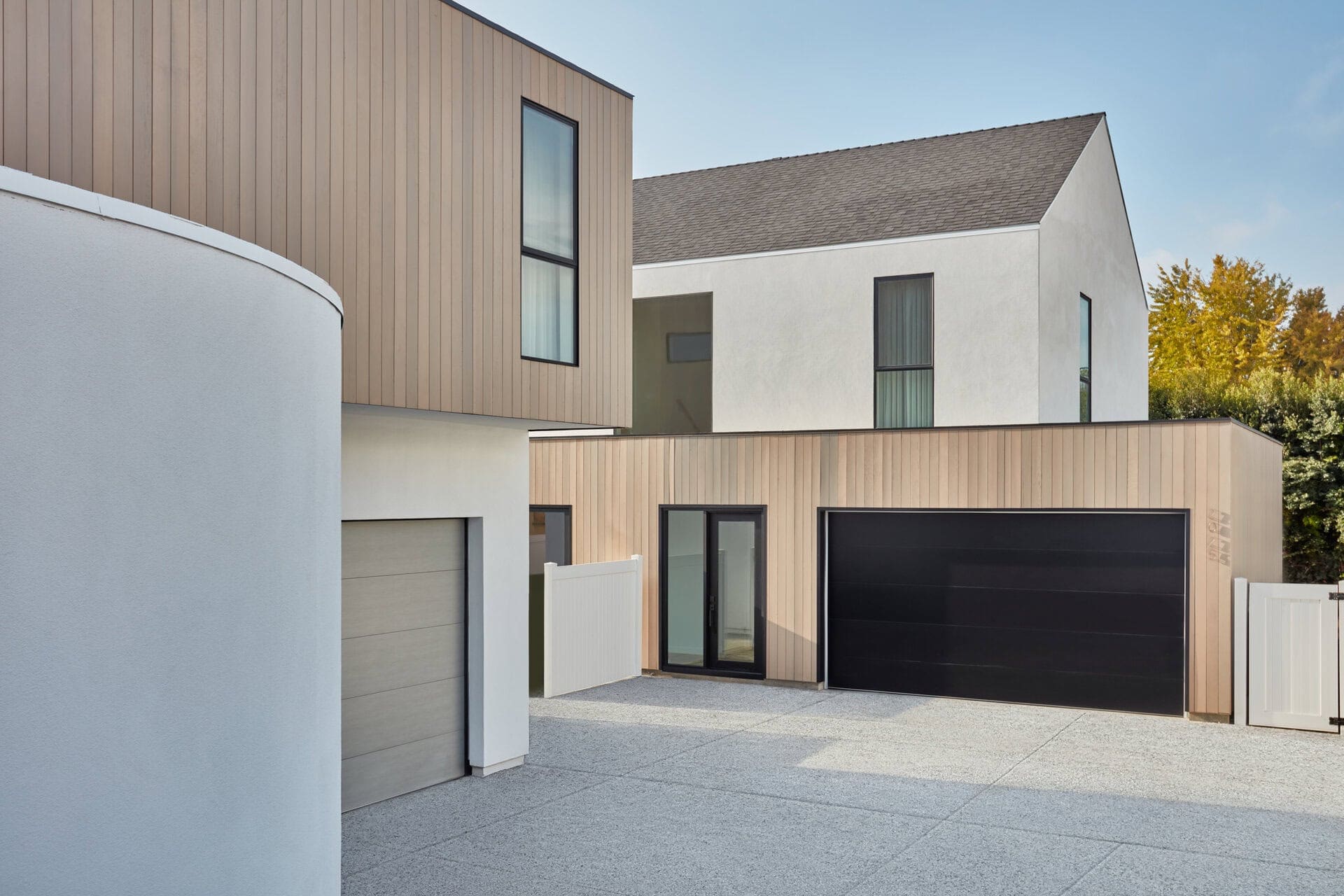 Contemporary residential home with mixed materials and modern design elements.