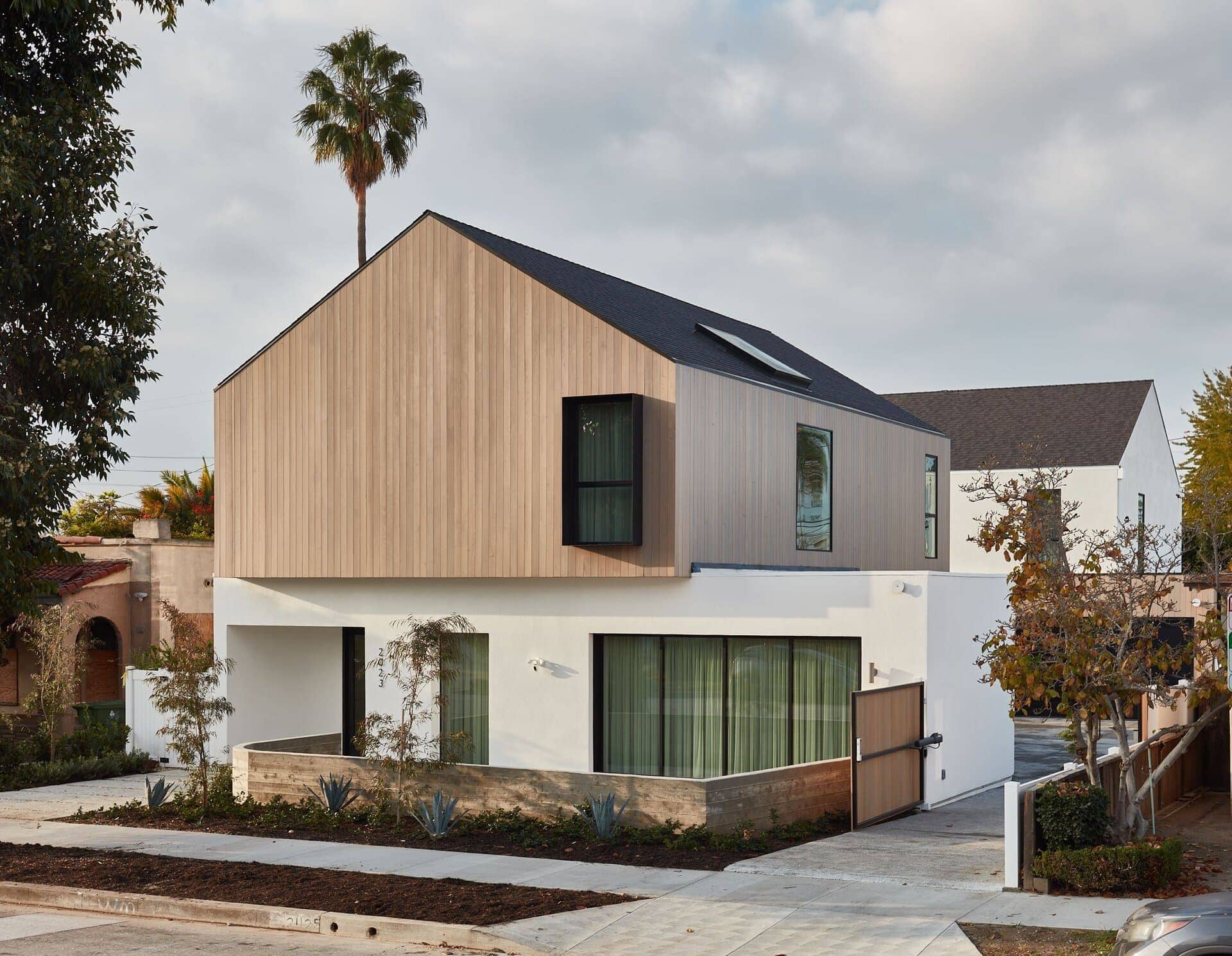 Modern residential architecture house exterior with mixed materials.