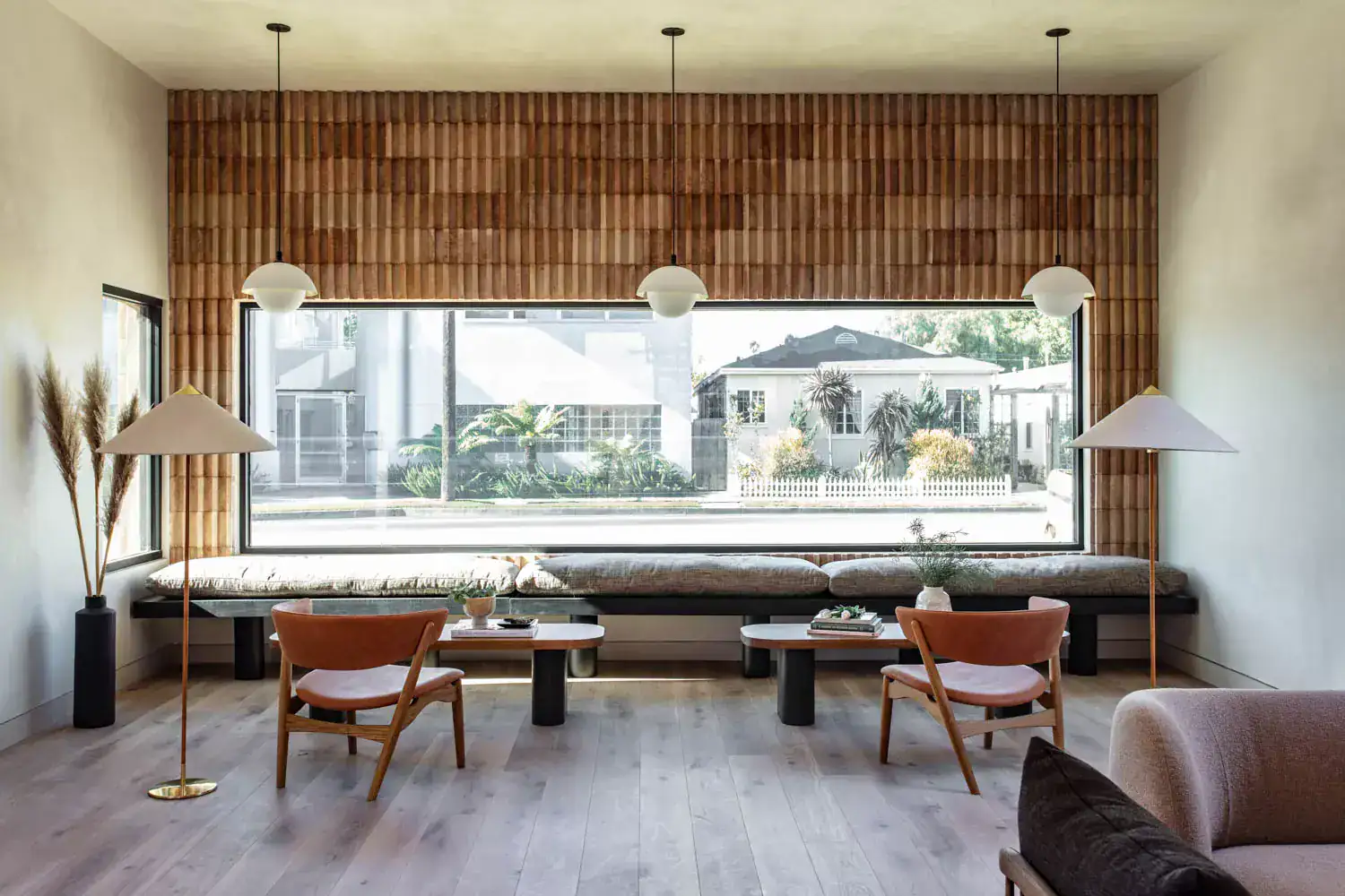 Modern interior living space with natural light, minimalist decor, wooden accents, and neutral tones.