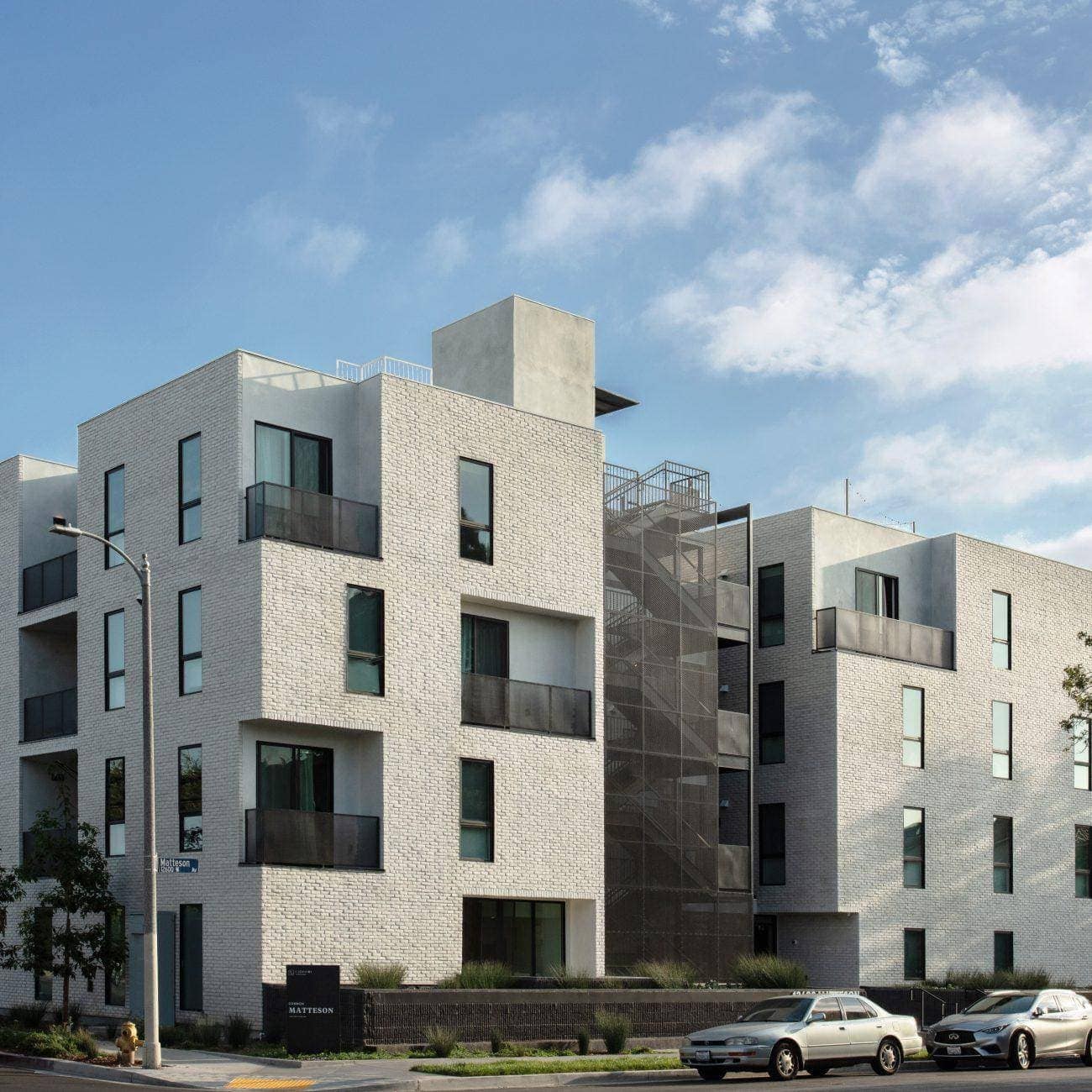 Contemporary residential apartment building with modern brick façade and balconies.