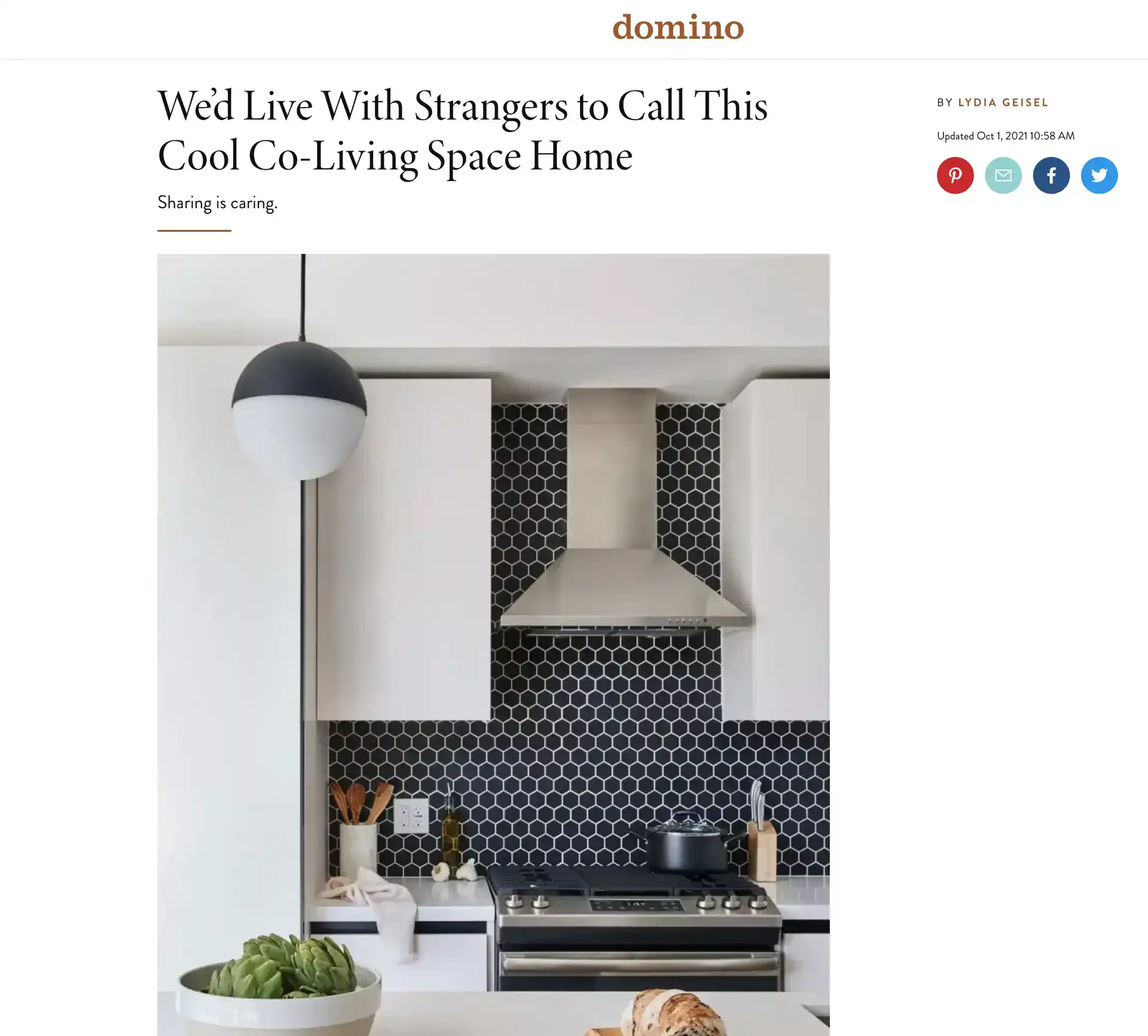 Black and white kitchen with hexagonal tile backsplash and modern appliances.