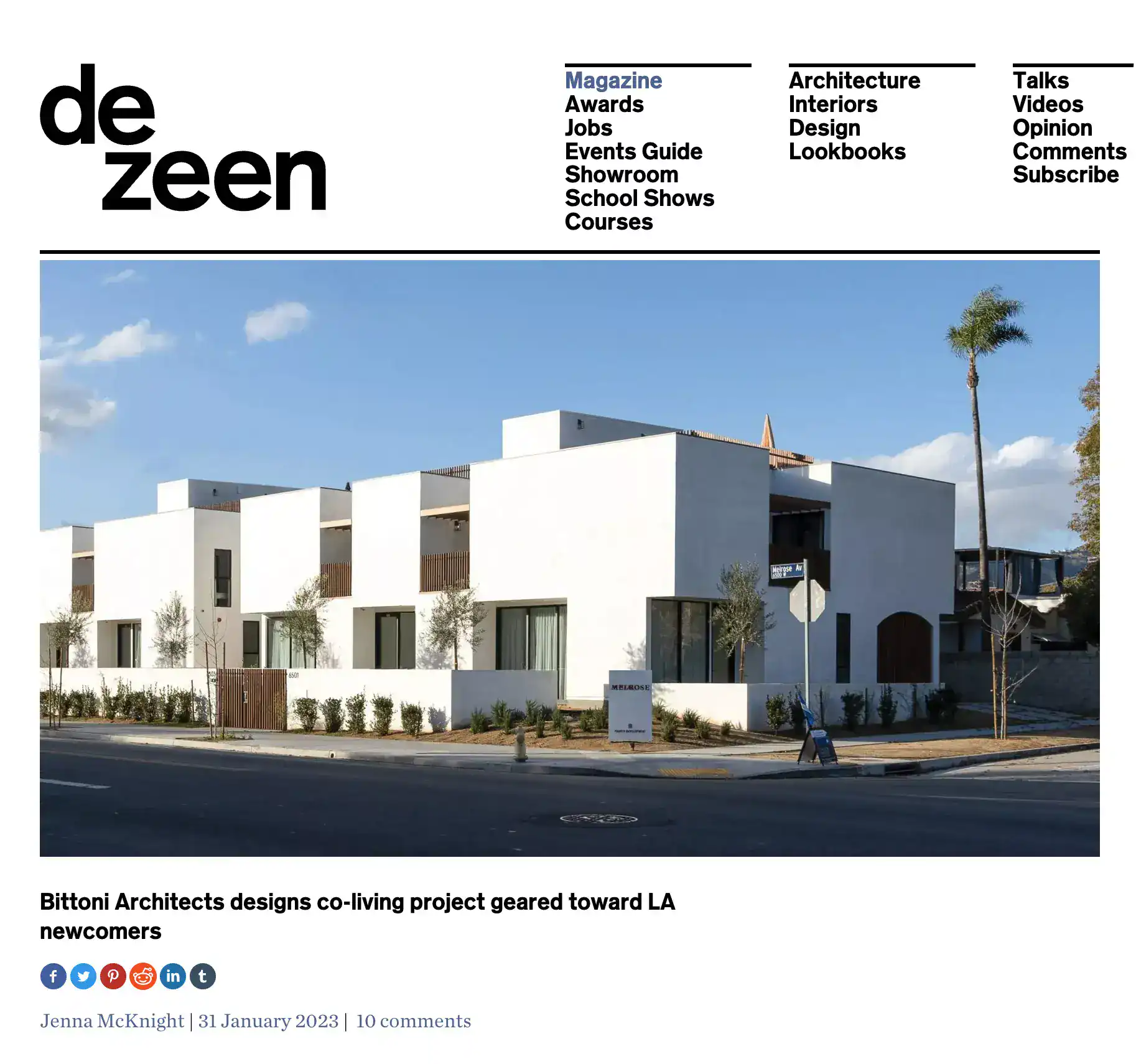 Modern white stucco co-living buildings with flat roofs and minimalist design, featuring large windows and small landscaped front yard.